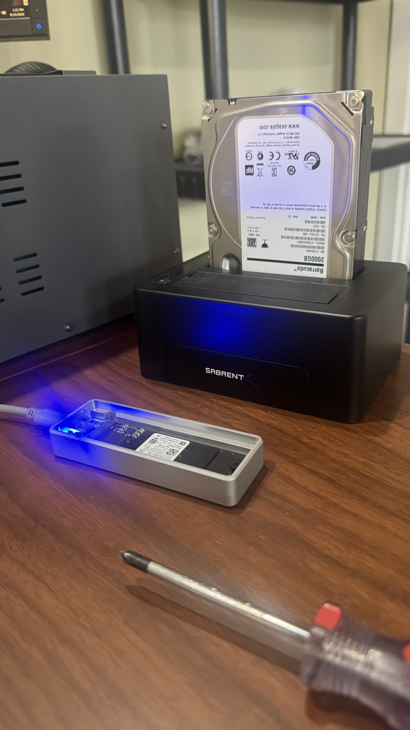 Technician prepping an NVMe SSD for data migration and drive cloning from HDD in dock at MyTown Computer Service in Mt. Pleasant MI.