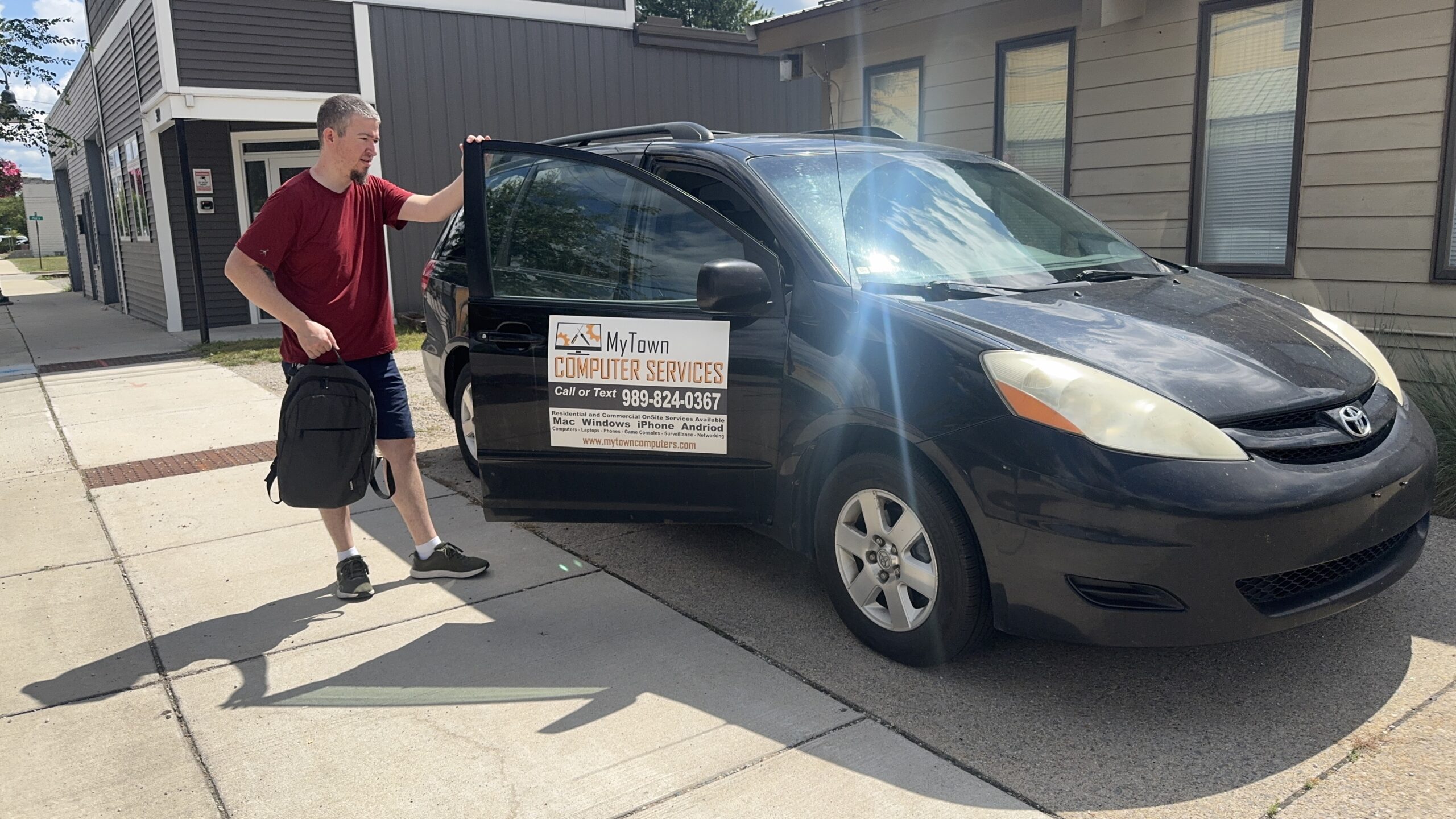 Side view of the MyTown Computer Service mobile repair vehicle getting loaded up for house call in Mt. Pleasant MI.