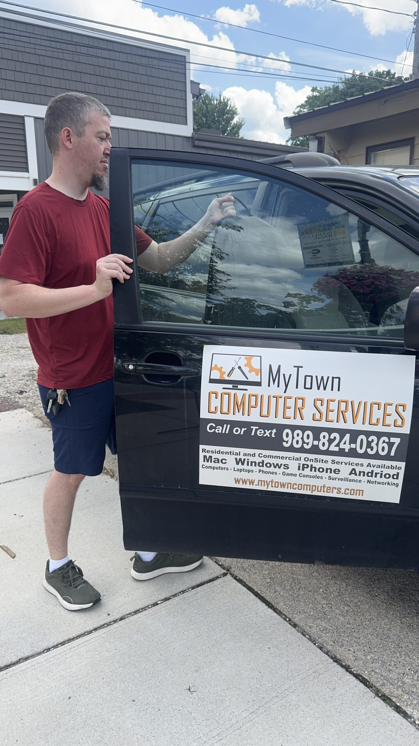 Side view of the MyTown Computer Service mobile repair vehicle getting loaded up for house call in Mt. Pleasant MI.